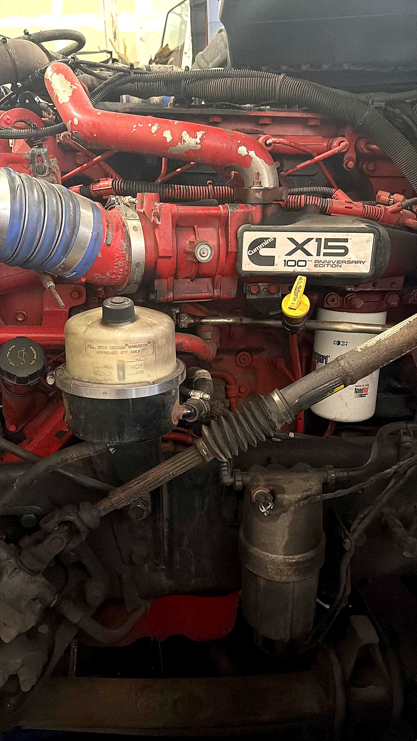 Heavy-duty diesel engine in the engine bay of a commercial truck